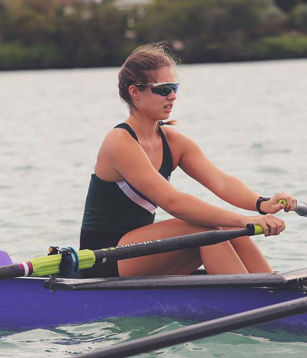 sarasota-scullers-club-0121 Female bow rower in a quad at half-stroke.