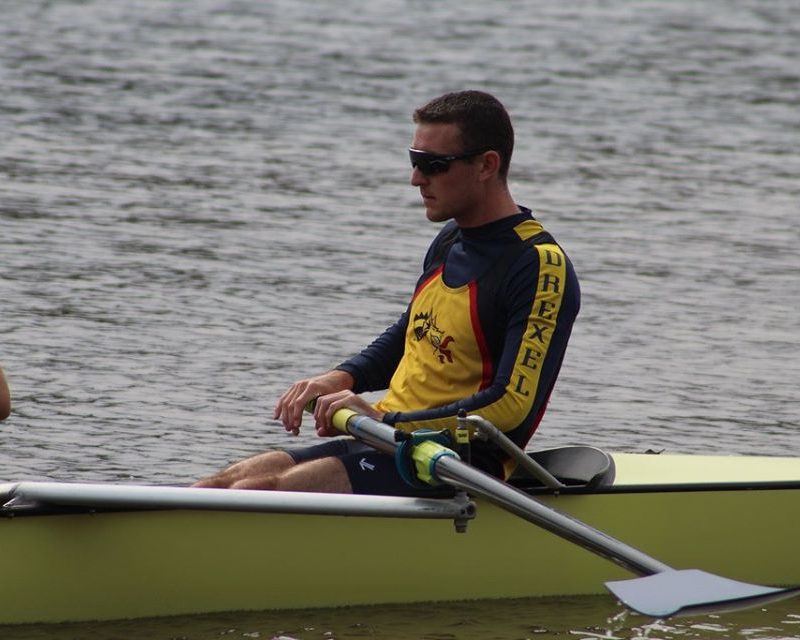 Alumni Chris Cail as bow rower